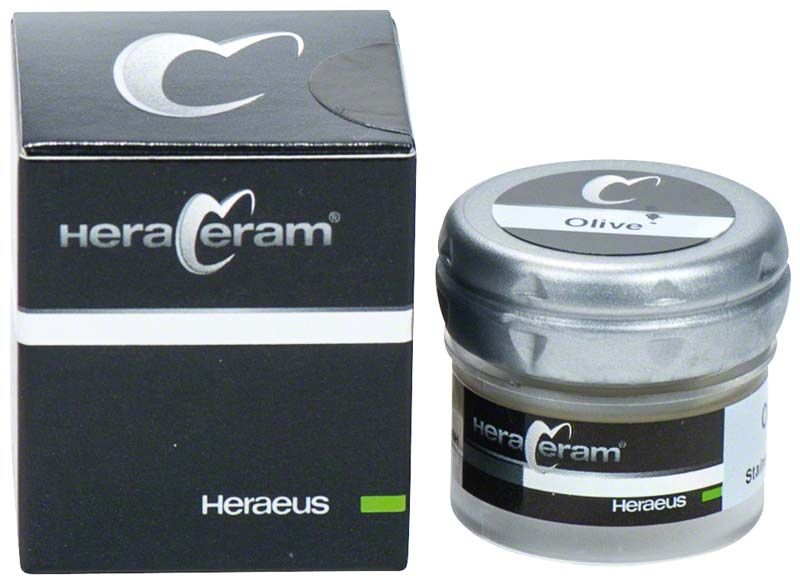 HeraCeram® Stains universal Paste Olive in einem Glasbehälter neben der Verpackung.