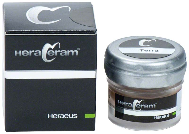 HeraCeram® Stains universal Paste Terra in schwarzer Verpackung und transparentem Glasgefäß.
