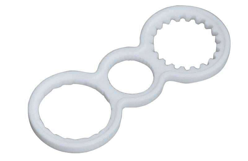 Eindrehhilfe für Adapterserie in weißer Farbe mit gezackten Rändern.