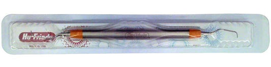 Gracey-Kürette mesial mit orangefarbenem Griff in Kunststoffverpackung.