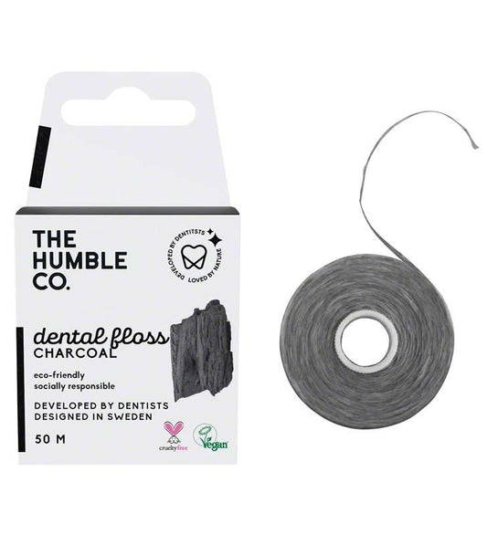 Zahnseide mit Aktivkohle, umweltfreundlich, in weißer Verpackung.