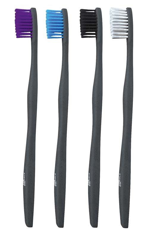 Vier pflanzenbasierte Zahnbürsten in verschiedenen Farben, schwarz und weiß sowie lila und blau.