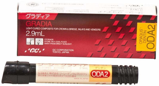 Gradia Opaque Dentin ODA2 Komposit mit Verpackung auf weißem Hintergrund.