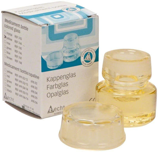 Kappenglas Buntglas gelb mit Verpackung im Hintergrund.