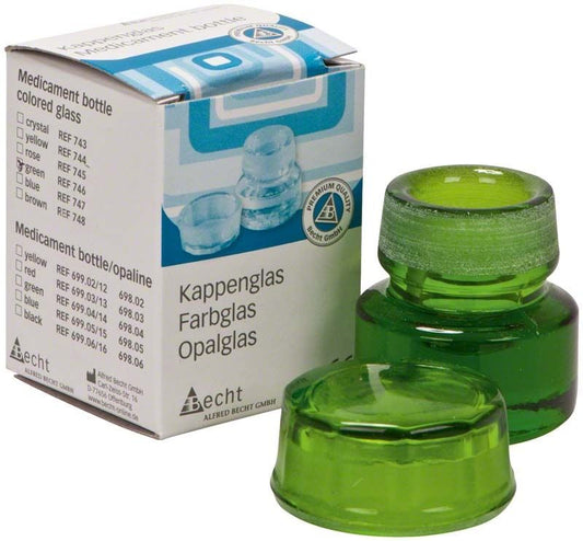 Kappenglas Buntglas grün mit Verpackung im Hintergrund.