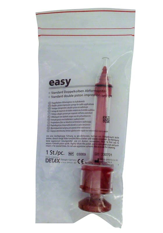 Applikationsspritze in transparenter Verpackung mit rotem Kolben und Verschluss.