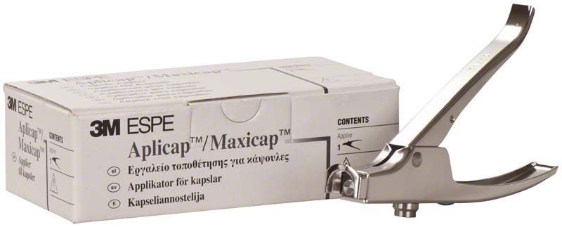 3M™ Maxicap™ Applier neben Verpackung der Aplicap™ Kapseln.