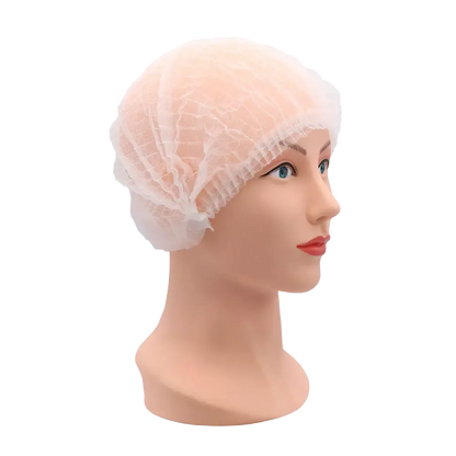Leicht transparente PP Klipphaube aus Polypropylen-Spinnvlies auf Modellkopf.