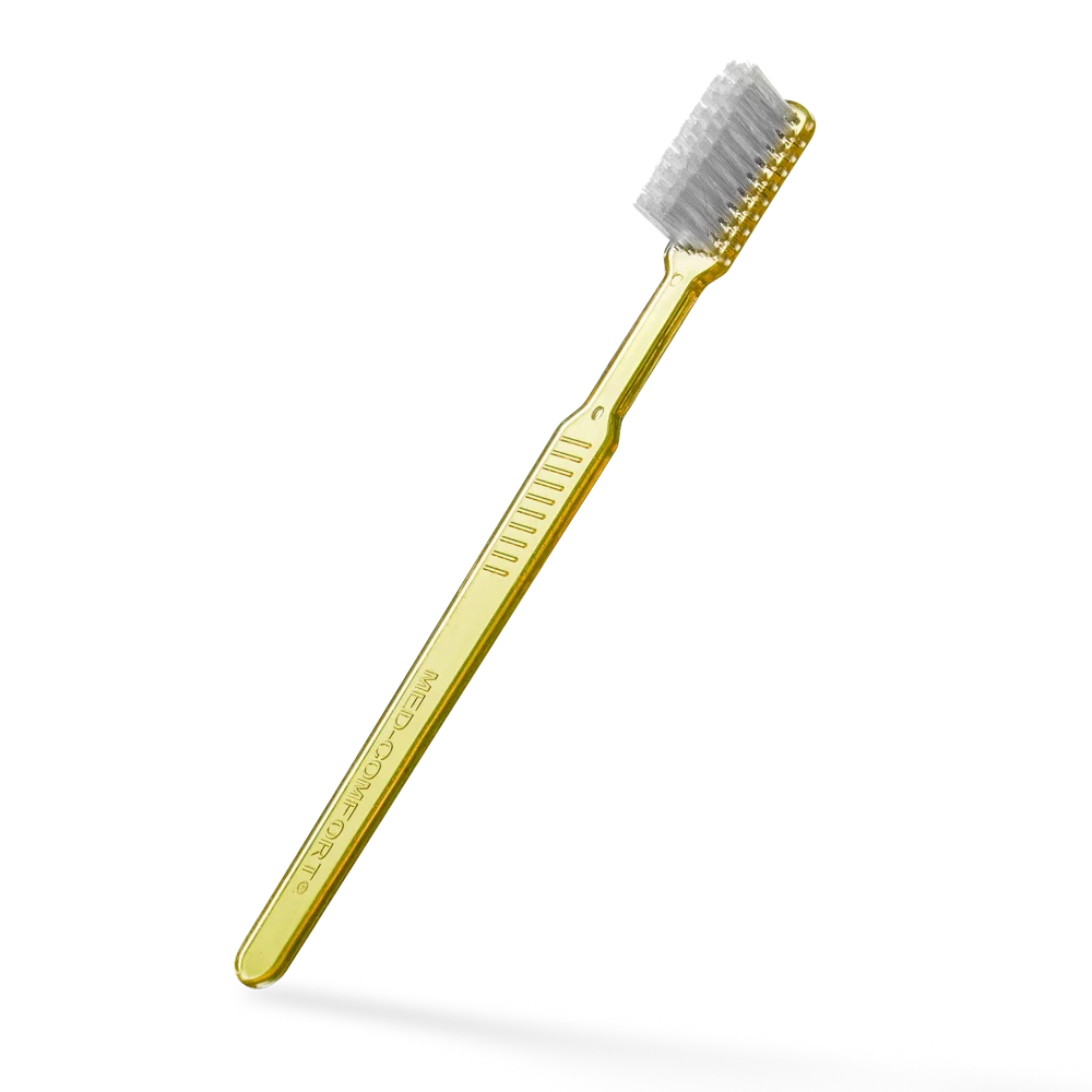 Einmalzahnbürste mit Zahnpasta, gelb, aus Polystyrol, ca. 15 cm lang.