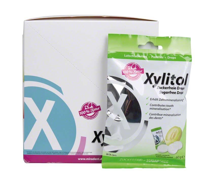 Tüte mit Xylitol Drops Melone vor Verpackungsbox, zahnfreundlich und zuckerfrei.