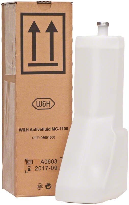 W&H Activefluid MC-1100, 1000ml Flasche neben der Verpackung.