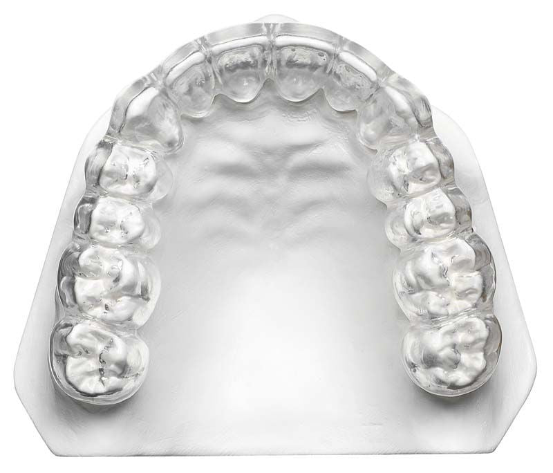 Klarer Tiefziehfolie-Abdruck von Zahnmodell, geeignet für dentalmedizinische Anwendungen.