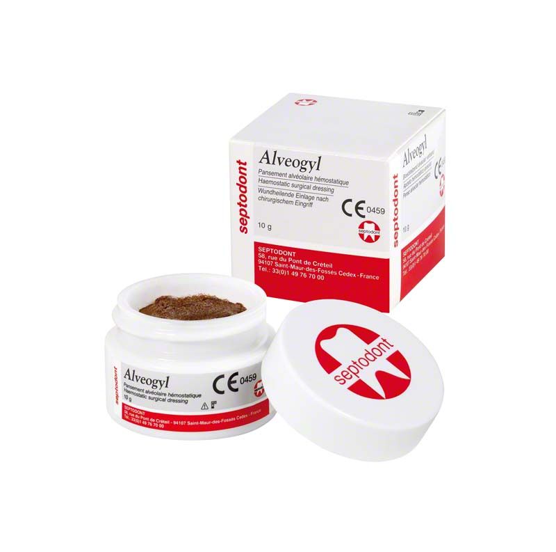 Alveogyl Paste in geöffneter Dose neben der Produktverpackung.