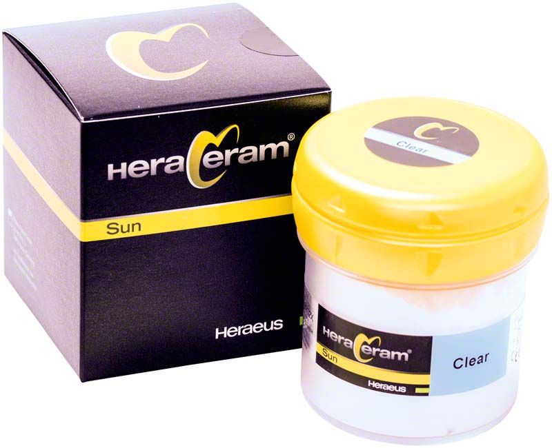 HeraCeram® Sun Transpa 100g Dose mit gelbem Deckel und Verpackung.