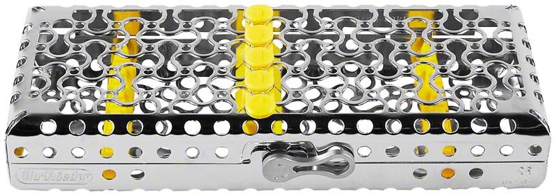 Kassette aus Edelstahl mit gelben Silikoneinsätzen für medizinische Instrumente.