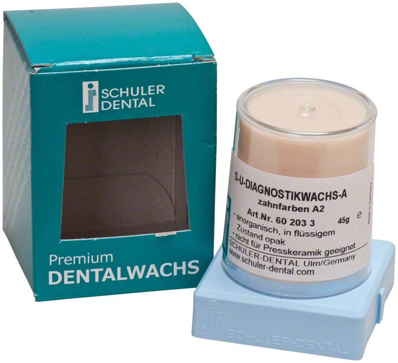S-U-Diagnostikwachs A zahnfarben A2 neben Verpackung.