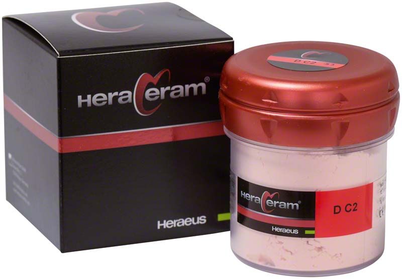 HeraCeram® Dentin DC2 100g in rotem Behälter neben schwarzer Verpackung.