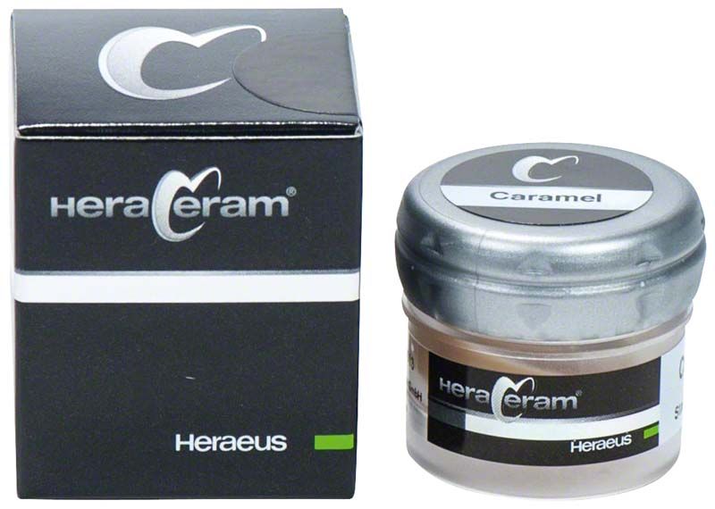 HeraCeram® Stains universal Paste Caramel neben schwarzer Verpackung mit Logo.