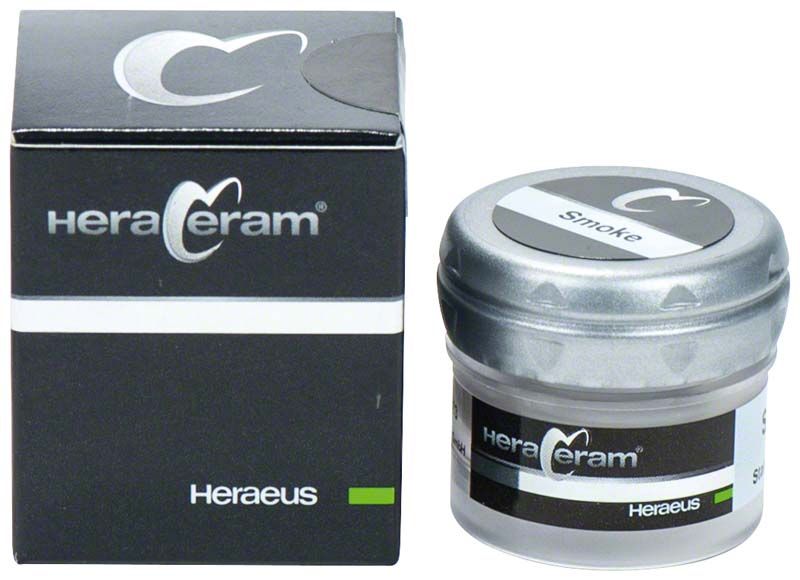 HeraCeram® Stains universal Paste Smoke, Glasbehälter neben Verpackung, schwarzes Design.
