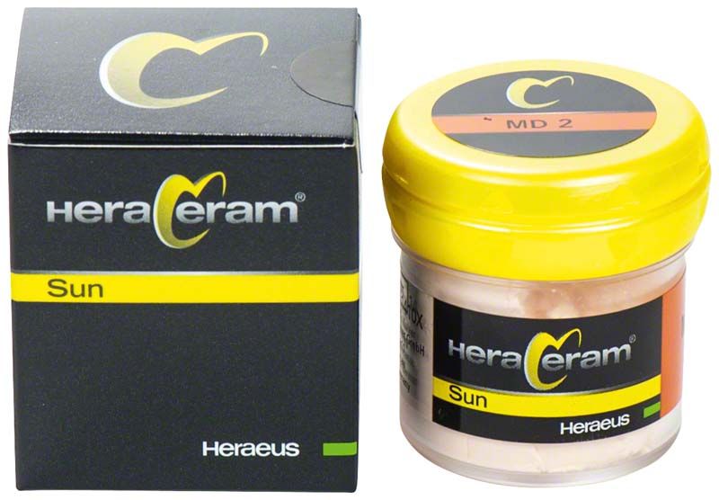 HeraCeram®Sun Mamelon-Dentin MD2 im gelben Kunststoffbehälter und schwarzer Verpackung.