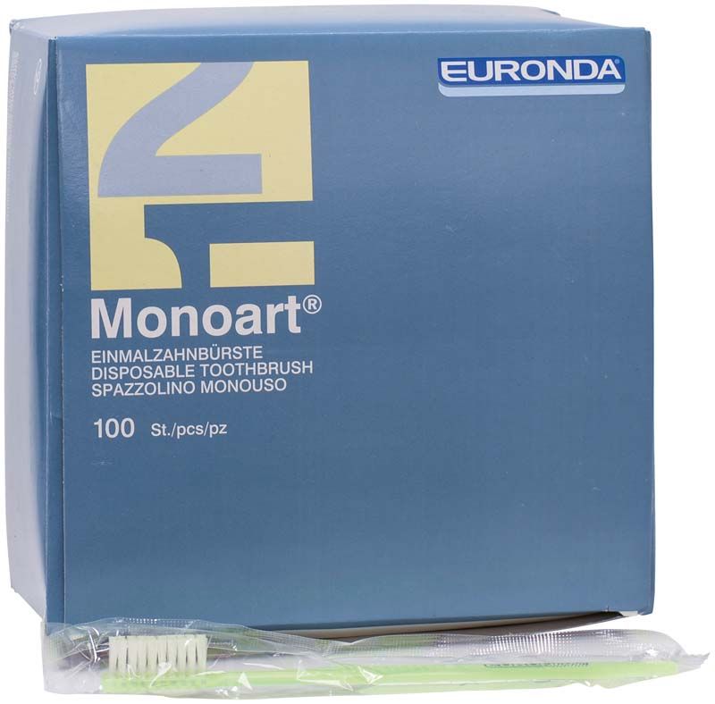 Einzeln verpackte grüne Einmalzahnbürste Monoart von Euronda vor blauer Verpackung.