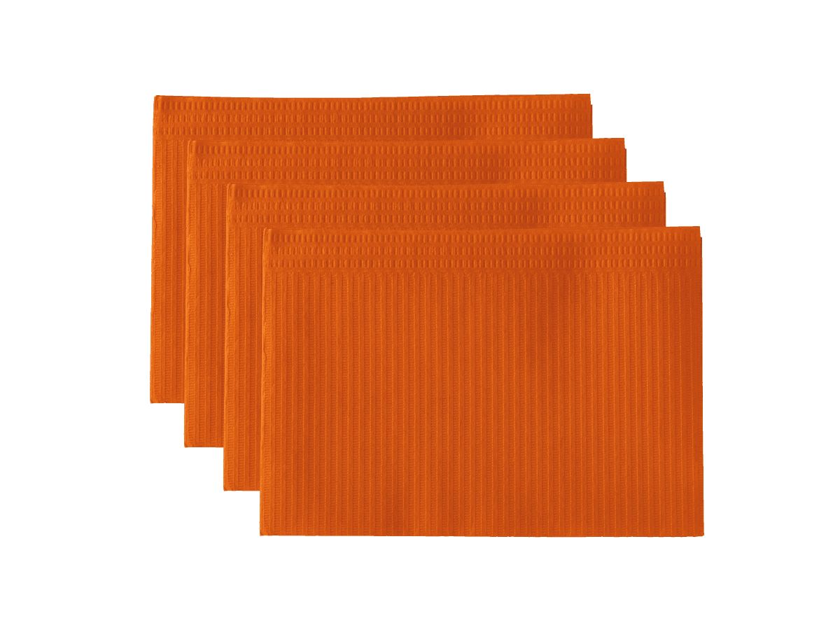 Monoart Patientenservietten Towel UP orange in gestapelter Anordnung.