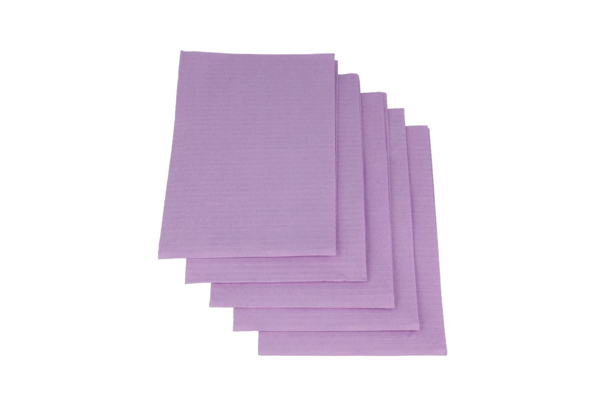 Lila Monoart Patientenservietten in gestapelter Anordnung.