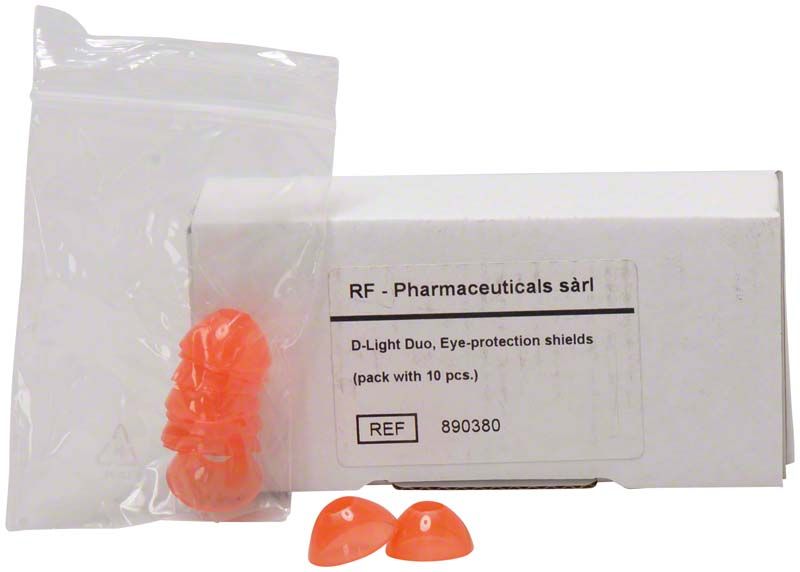 D-Light® Pro / Duo Augenschutz mit Verpackung und orangefarbenen Schutzschalen.