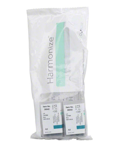 Harmonize™ Unidose Schmelz A2 Verpackung mit zwei Kapseln in Plastikbeutel.