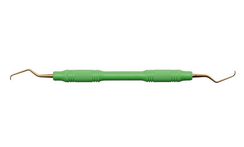 Ergonomisch geformte Kürette mit grünen Griffen und goldfarbenen Spitzen.