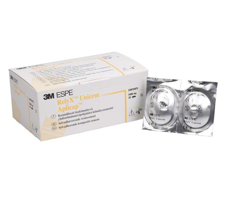 3M RelyX Unicem Aplicap Verpackung und zwei versiegelte Kapseln im Vordergrund