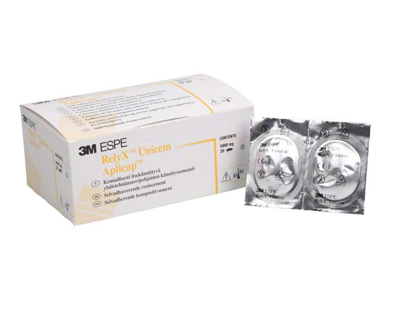 3M RelyX Unicem Aplicap Verpackung und zwei versiegelte Kapseln.