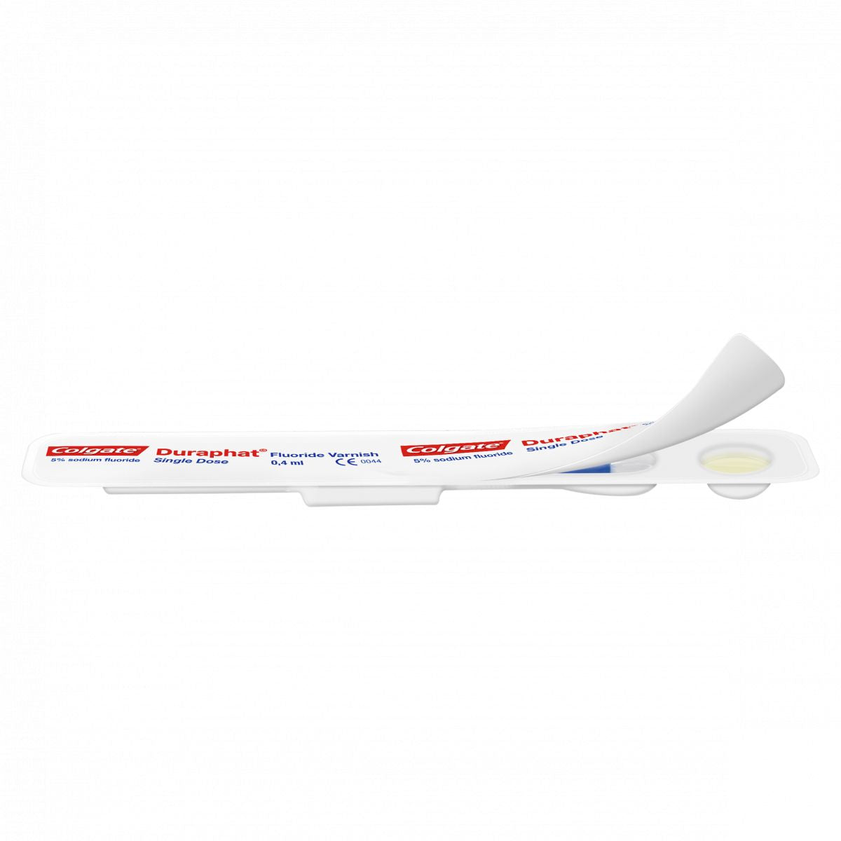 Duraphat® Einzeldosis-Verpackung mit aufgerollter Schutzfolie und Sicht auf Fluoridlack.