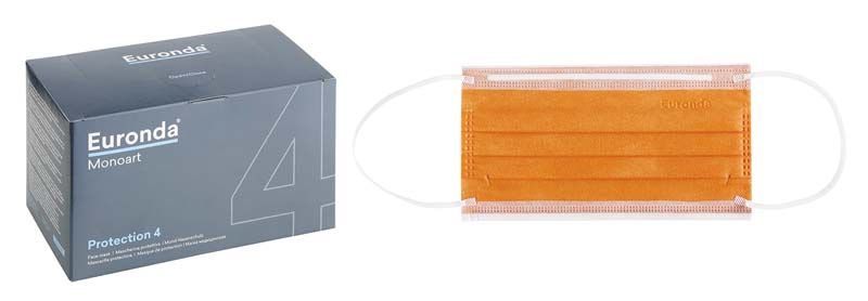 Orangefarbener medizinischer Mundschutz mit Gummizug neben grauer Verpackung.