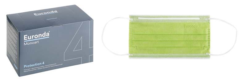 Monoart Mundschutz Pro 4 in Hellgrün mit Verpackung im Hintergrund.