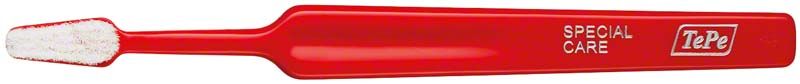 Ultraweiche TePe Special Care Zahnbürste mit rotem Griff und weißen Borsten.