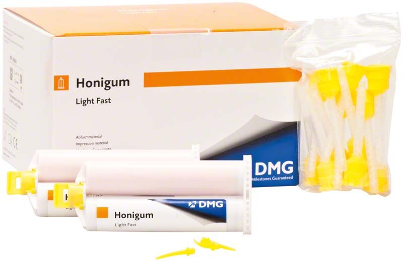 Honigum Automix light fast Kartuschen mit gelben Mischspitzen vor Verpackung.