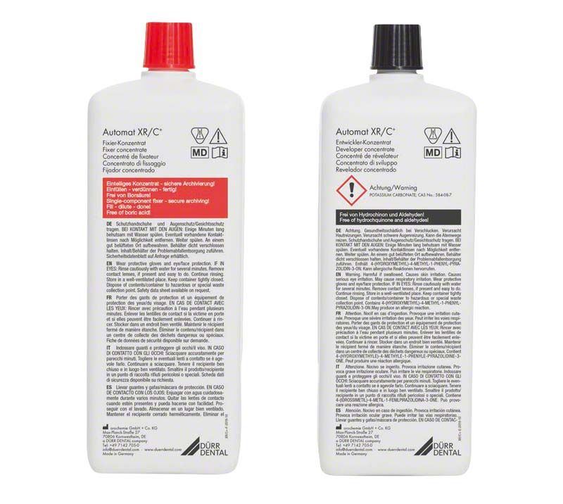 Automat XR/C+ Entwickler- und Fixiererflaschen mit Sicherheitskennzeichnungen.