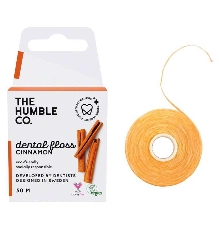 Humble Zahnseide Zimt mit Verpackung, Zimtstangen und umweltfreundlichen Symbolen.
