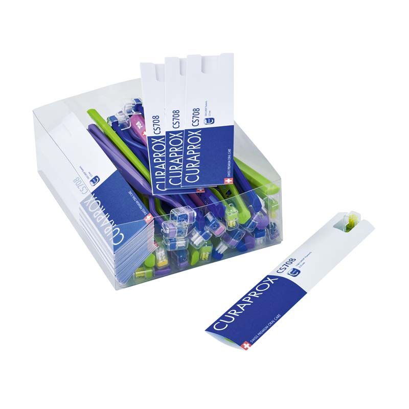 CURAPROX CS 708 Zahnbürsten in transparentem Behälter mit blauer Verpackung.