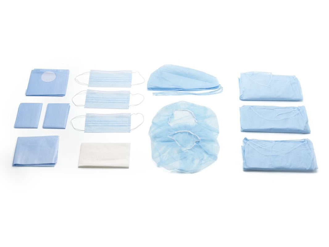 Steriles OP-Set für Implantologie mit blauen Schutzkitteln und Masken.