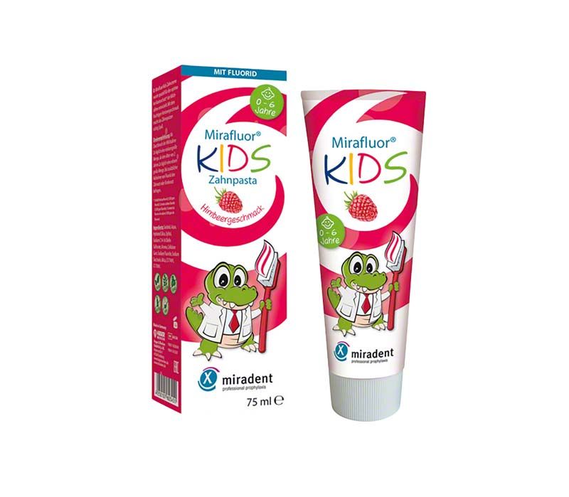 Mirafluor® Kids Himbeere Zahnpasta-Tube und Verpackung mit Krokodil-Illustration.