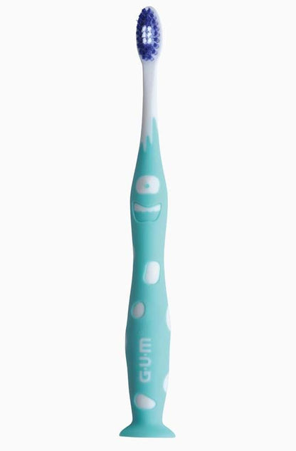 Kinderzahnbürste GUM® JUNIOR, blaues Design mit lustigem Gesichtsmuster.