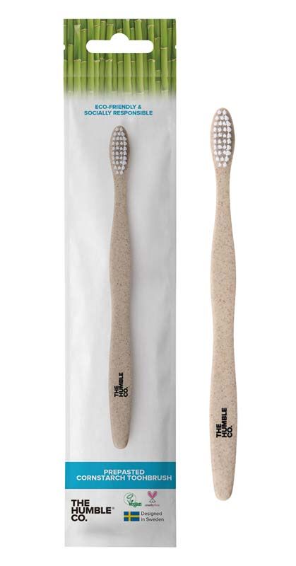 Humble Brush Maisstärkezahnbürste in Verpackung mit veganem Symbol.