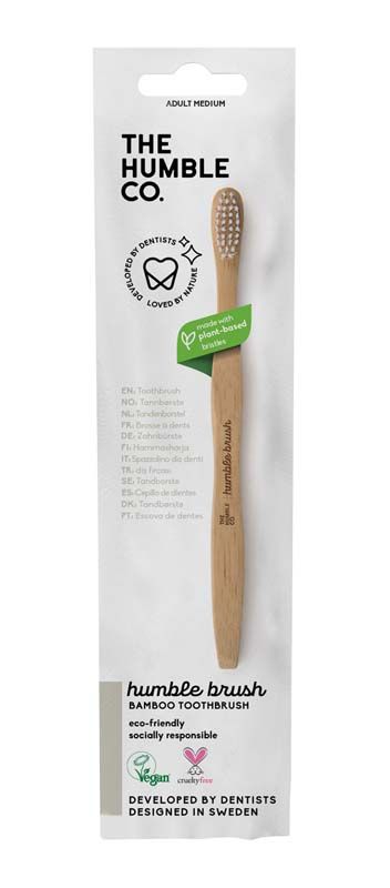 Verpackung der Humble Brush Zahnbürste mit Holzgriff und weißem Kopf, umweltfreundlich.