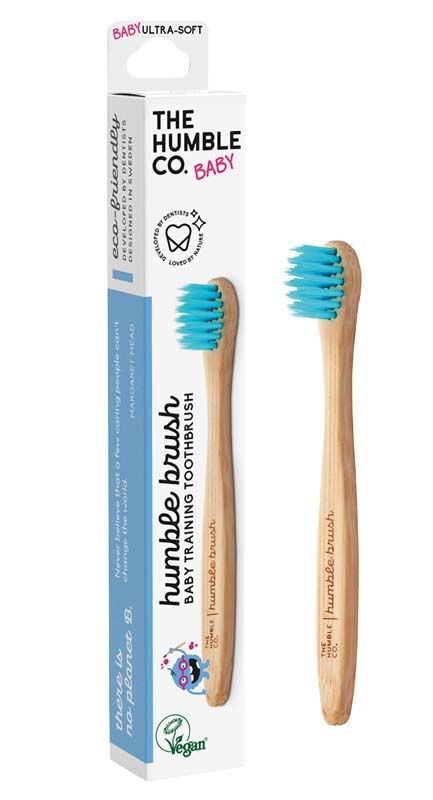 Hölzerne Babyzahnbürste mit blauen Borsten und Verpackung.