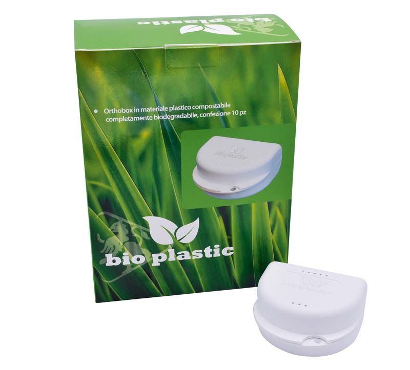 Bio Dento Box® II Weiß vor grüner Verpackung mit Bio-Kunststoff-Aufdruck.