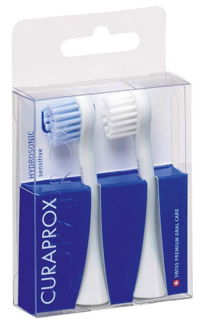 CURAPROX Hydrosonic Pro Bürstenköpfe sensitiv, Nahaufnahme von drei Bürstenköpfen in Verpackung.