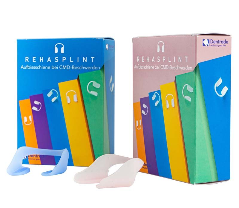 RehaSplint soft Aufbissschienen in blau und rosa vor Verpackungen.