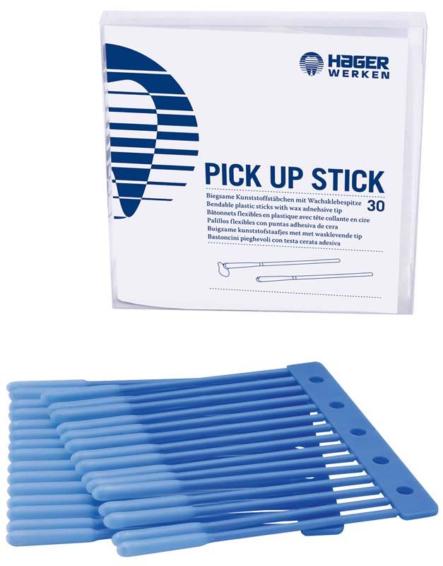 Blaue Applikationsstäbchen mit Wachsklebespitze neben der Produktverpackung.